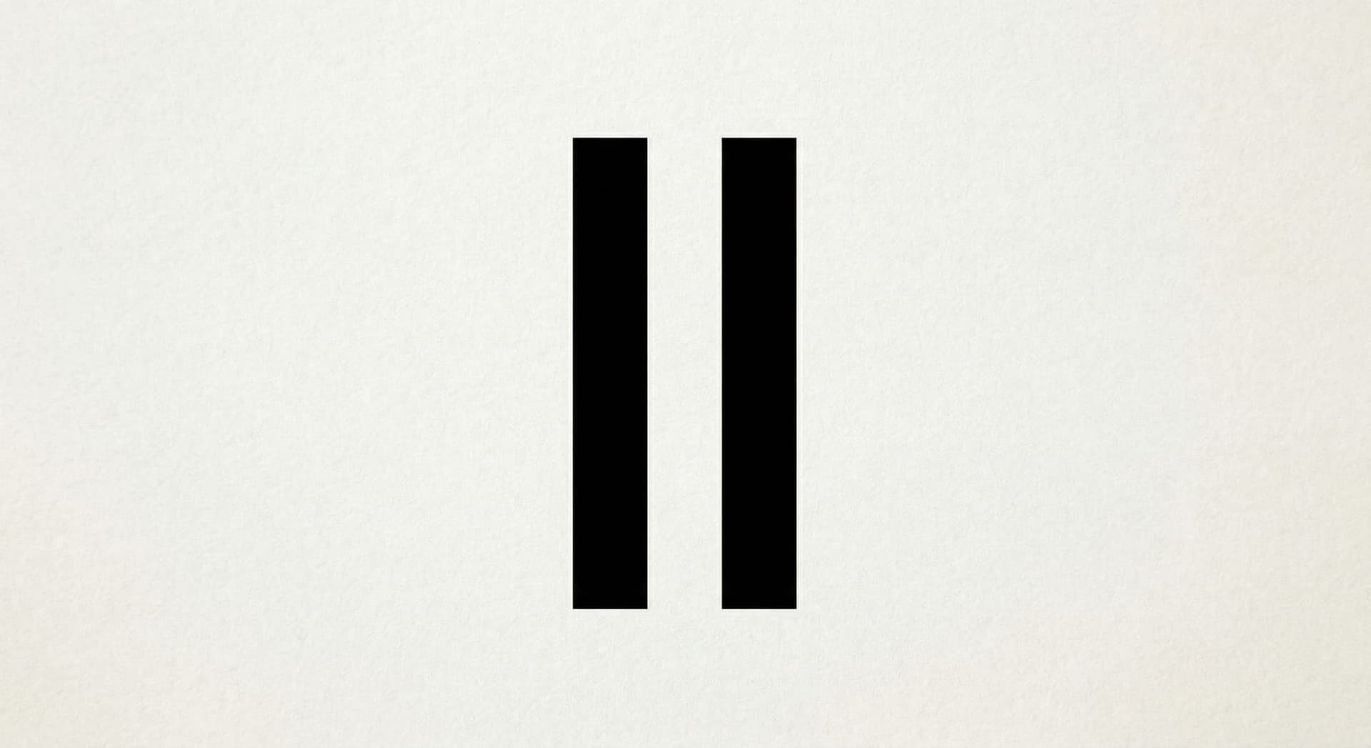 Aerial golden hour view of Fort Wayne Indiana downtown skyline with rivers and office buildings reflecting warm sunset light