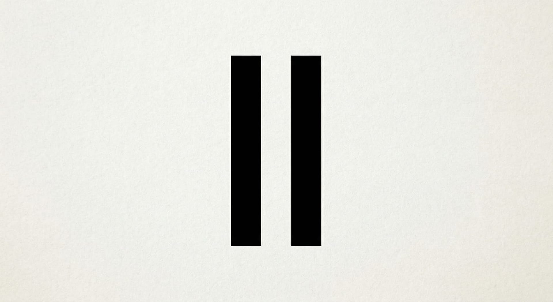 Aerial golden hour view of Fort Wayne Indiana downtown skyline with rivers and office buildings reflecting warm sunset light